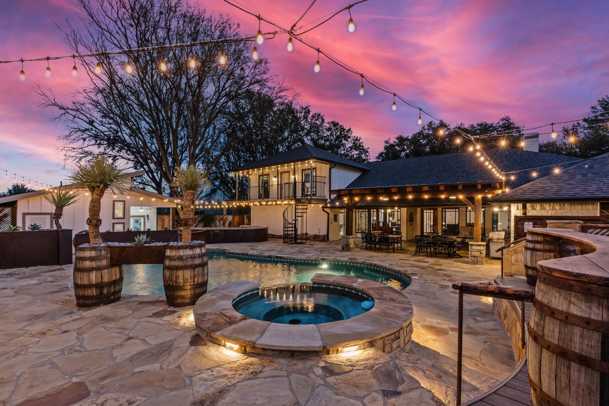 Pool courtyard and veranda glowing at twilight