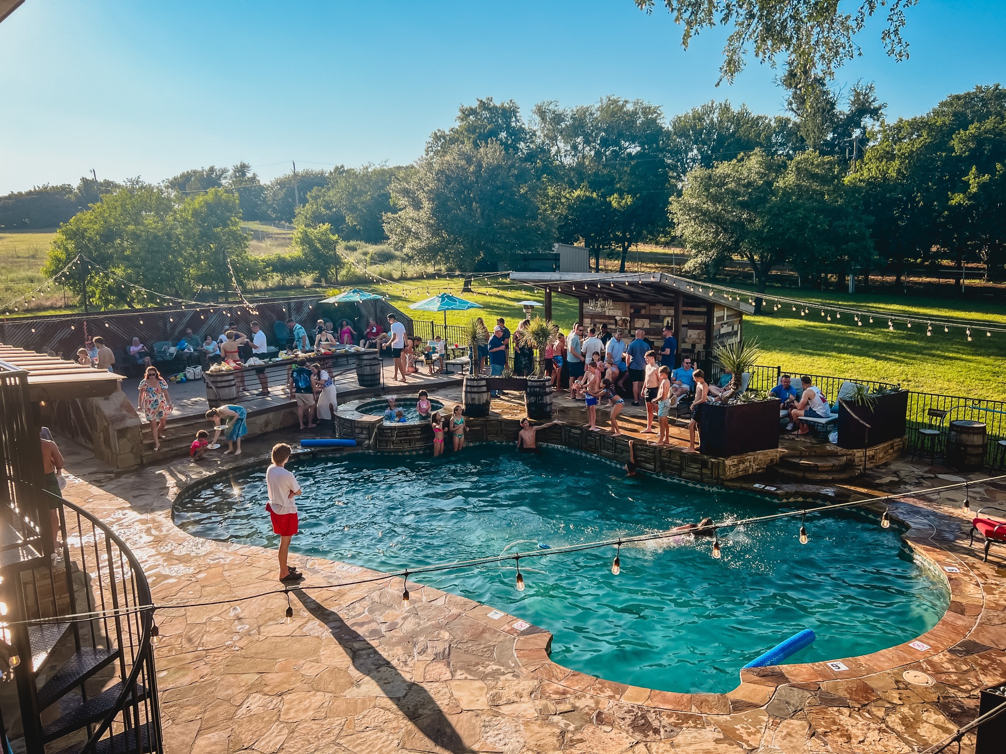 Family and friends gathered around the pool in the late Texas sun