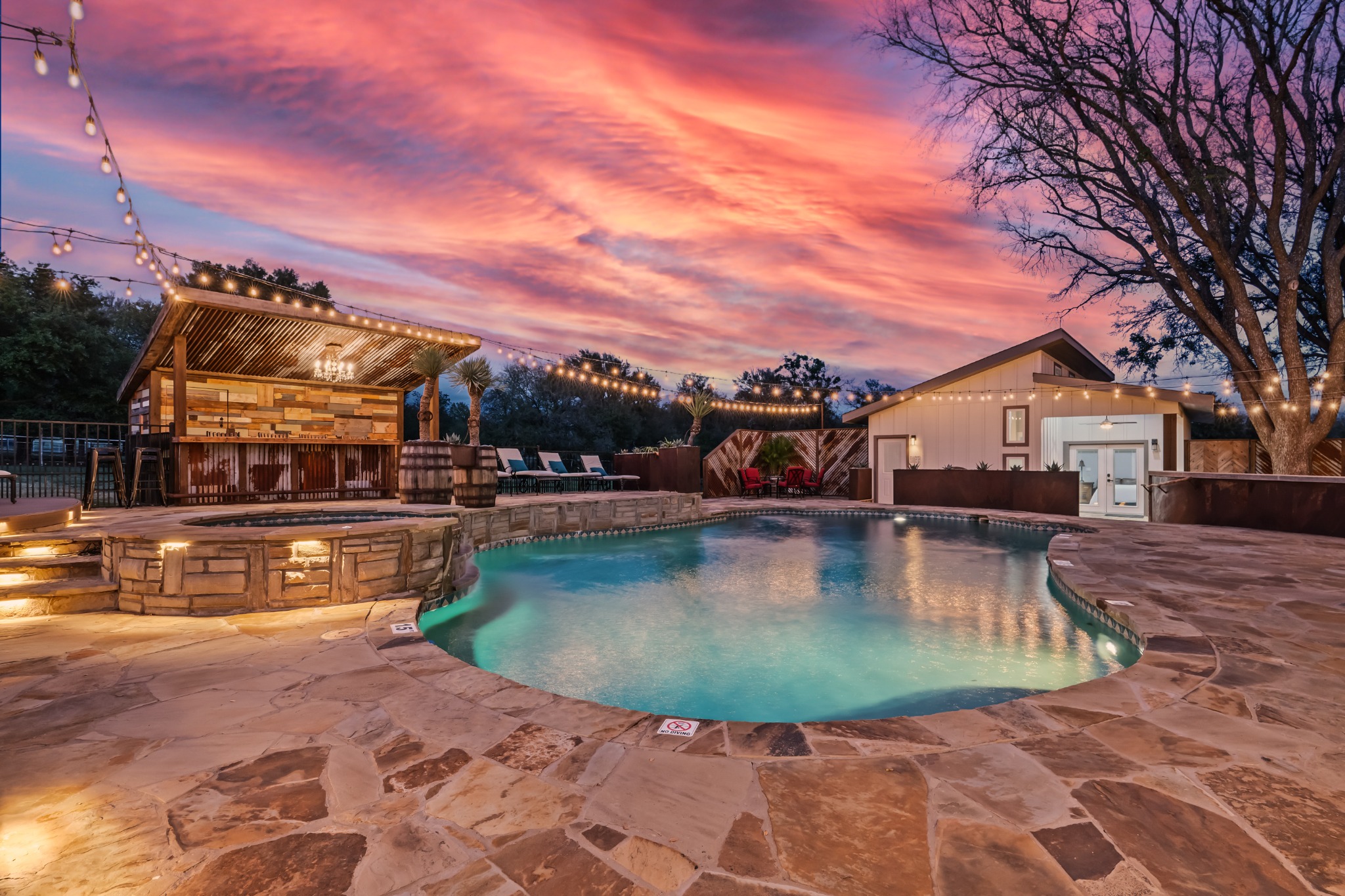 Still pool water reflecting the Texas sunset