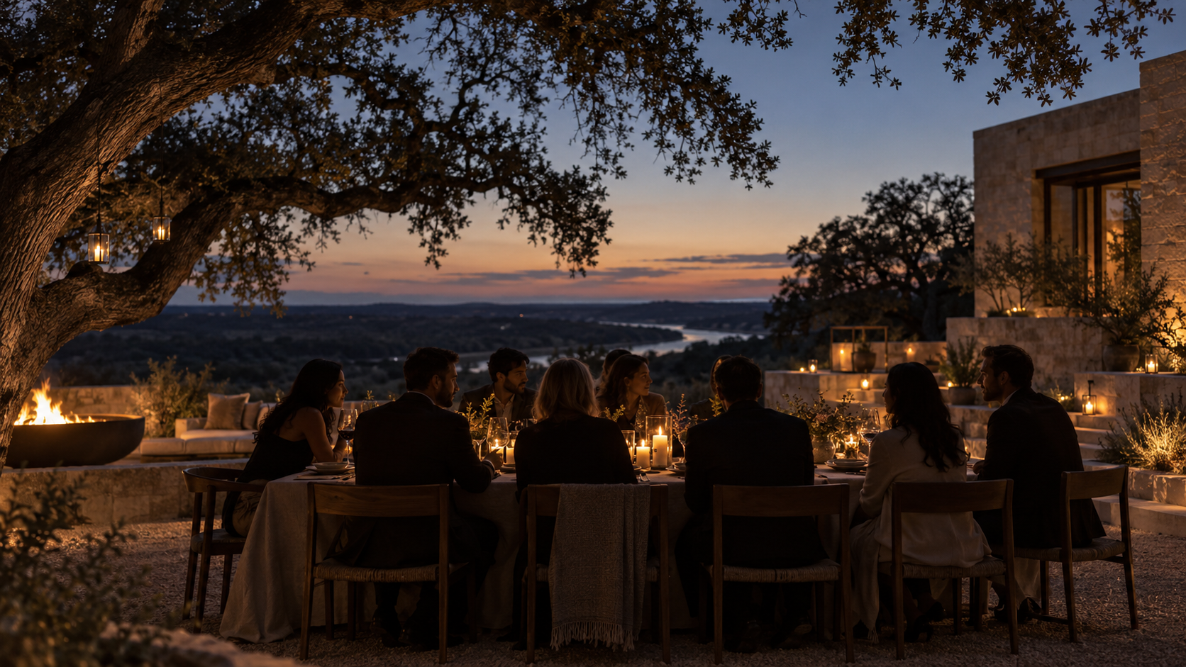Friends gathered for a candlelit dinner beneath Texas live oaks
